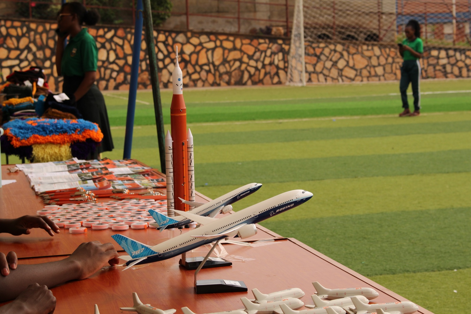 Model aircraft and a rocket model laid out on the JdiobeSTEM exhibition table at the Green Festival
